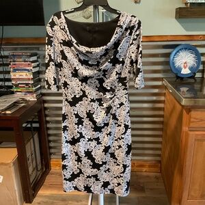 Form fitting, flattering, scoop neck dress.